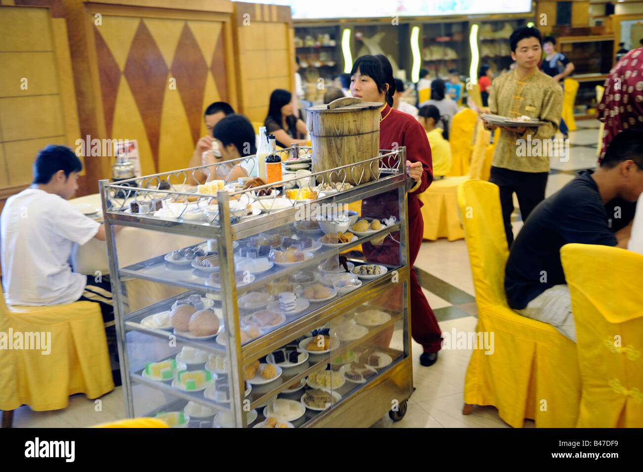 People have Cantonese Dim Sum with tea in a restaurant in Dongguan, Guangdong, China. 20-Sep-2008 Stock Photo