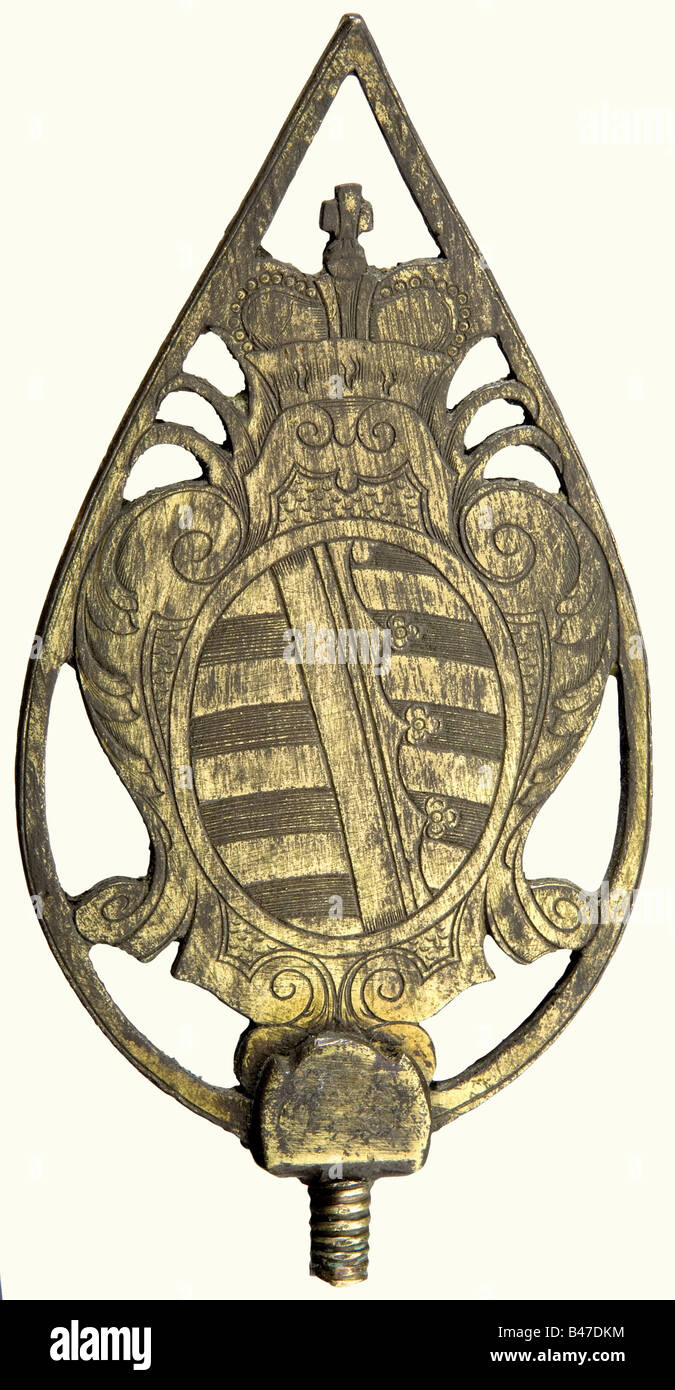 A flag pole finial for a Saxon Dukedom, middle/end of the 18th century. Etched, gilded brass. A rocaille-ornamented cartouche bearing the Saxon coat of arms and the elector's crown on the obverse side, and a reversed monogram 'F' on the back. Height 13 cm. The monogram refers either to Friedrich III of Saxe-Coburg-Gotha (1699 - 1732 - 1772) or Friedrich of Saxe-Hildburghausen (1763 - 1780 - 1834). historic, historical, 19th century, 18th century, Saxonia, Saxony, Saxonian, German, Germany, object, objects, stills, clipping, clippings, cut out, cut-out, cut-outs, Stock Photo
