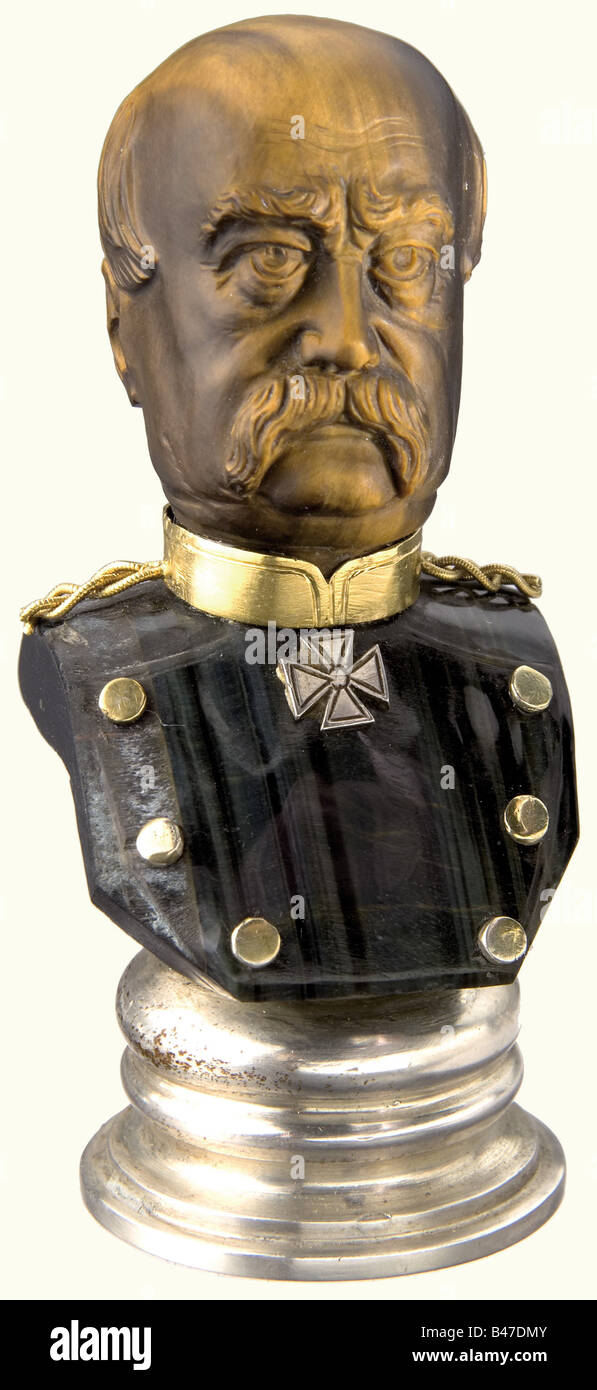 Bernhard, Prince von Bülow (1849 - 1929) - a personal seal for the Imperial Chancellor and Prussian Prime Minister during 1900 - 1909., Made in the shape of a bust of Bismarck, the head is extremely finely cut in Tiger's Eye, the upper body is made of green-black banded agate. The collar, epaulets, and buttons are gold. The silver face of the seal is engraved with von Bülow's coat of arms surrounded by the inscription, 'Bernhard Graf von Bülow - Reichskanzler'. (In 1905, von Bülow was raised to the rank of Prince). Height 62 mm. From royal Bavarian possession. , Stock Photo