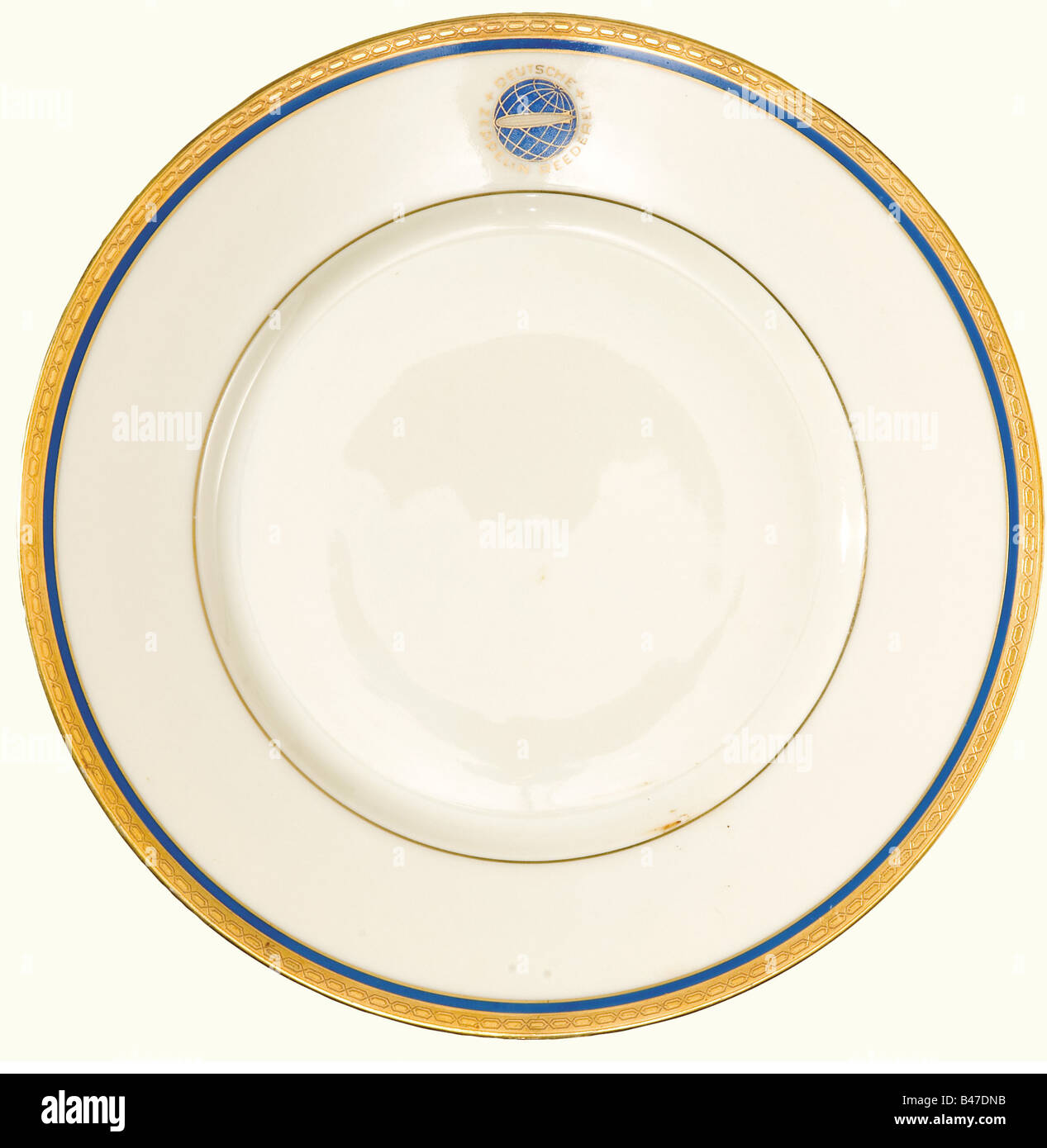 Six cake plates, from the German Zeppelin Shipping Line. Etched gold decorative rims set off with blue, and with the blue-gold emblem of the DZR (Deutsche Zeppelin Reederei) on the borders. Manufacturer's mark on the bottoms, 'Heinrich-Elfenbein-Porzellan Bavaria, Selb' and 'Eigentum der Zeppelin-Reederei' (Property of the Zeppelin Shipping Line). Diameter 20.3 cm. historic, historical, 20th century, transport, transportation, object, objects, stills, dishes, dish, plate, plates, porcelain, chinaware, Stock Photo