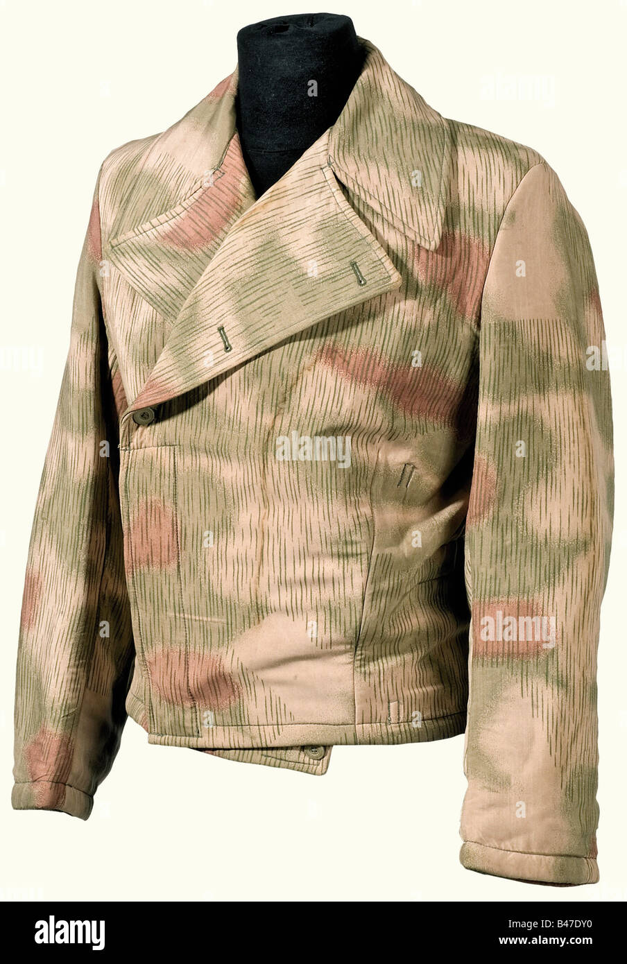 A camouflage jacket, in the special uniform style for tank troops. Swamp camouflage version, with white interior, but not reversible. Padded. Pressed cardboard buttons. Size, RB No. and LBA Stamp. The eagle has been detached. Stained. historic, historical, 1930s, 20th century, Air Force, branch of service, branches of service, armed service, armed services, military, militaria, air forces, object, objects, stills, clipping, clippings, cut out, cut-out, cut-outs, uniform, uniforms, outfit, outfits, textile, clothes, Stock Photo
