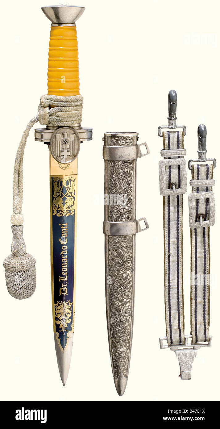 A dagger for a Leader of the German Red Cross, in Social Services. Partially gilded and blued blade with the dedication 'Dr. Leonardo Conti', and 'Für hervorragende Verdienste' (For Outstanding Merits). Silver-plated pommel and quillons, yellow plastic grip, sword knot. Nickel-plated iron scabbard, the suspension rings have quadrangular holes. The hanger has pale lilac coloured interweave and rectangular slides. Length 36 cm. Dr. Leonardo Conti (1900 - 1945) was head of the Reichs Health Service after 1939, Head of the NS German Doctor's Association, and Head o, Stock Photo