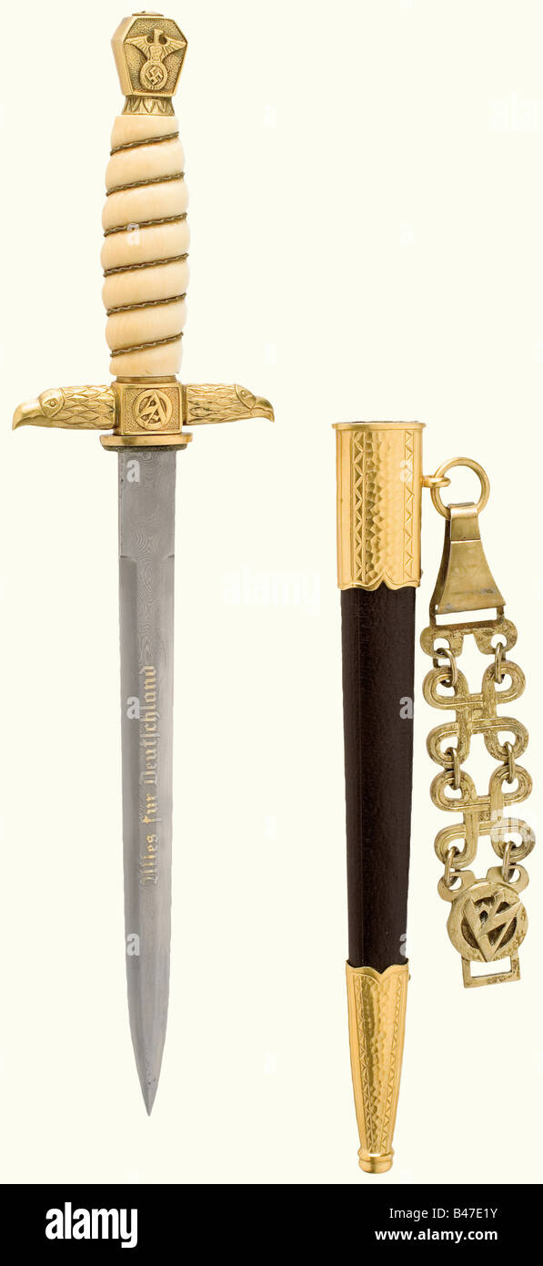 An SA honour dagger., Blade with etched Damascus pattern, the gilded motto, 'Alles für Deutschland' and manufacturer 'Eickhorn'. Gilded pommel and quillons with eagle head finials. Ivory grip(?) with wire winding. Brown, leather-covered scabbard with gilded mountings and chain suspension. Length 34 cm. Cf. Angolia, Daggers, Bayonets & Fighting Knives of Hitler's Germany, p. 33.The breakup of an edged weapons collectionThe pieces offered in this section of the auction were acquired since the post-war years from private possession or directly from the Solingen ma, Stock Photo