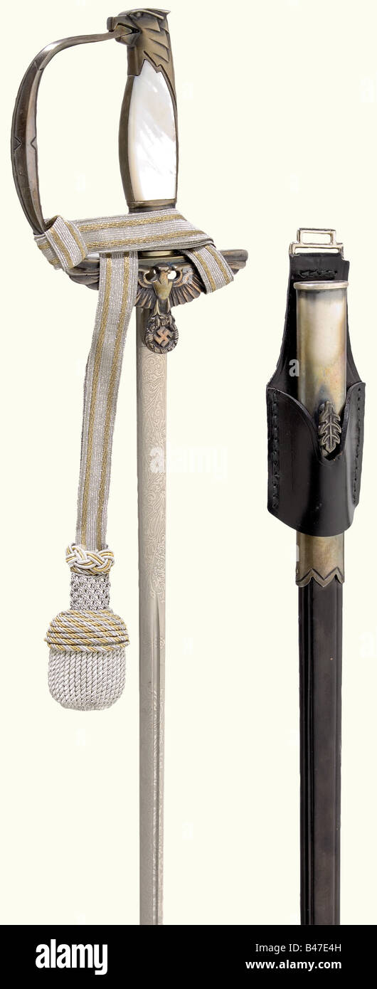 A model 1939 sword for an official, of the Diplomatic Corps. Blade with oval cross-section, fullers on both sides and decorative floral etchings with the national eagle, and the manufacturer's inscription, 'Weyersberg'. Silver-plated knucklebow hilt and eagle head pommel. Mother-of-pearl grip scales. Sword knot. Black leather scabbard with silver-plated mountings. Leather frog. Length 93 cm.The breakup of an edged weapons collectionThe pieces offered in this section of the auction were acquired since the post-war years from private possession or directly from t, Stock Photo