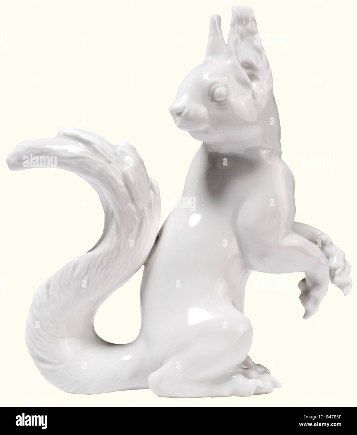 A squirrel., White porcelain. Base signed 'T. Kärner', model number '68', and green underglaze manufactory mark. Height 15.5 cm.' fine arts, 1930s, 1930s, 20th century, object, objects, stills, clipping, clippings, cut out, cut-out, cut-outs, Additional-Rights-Clearance-Info-Not-Available Stock Photo