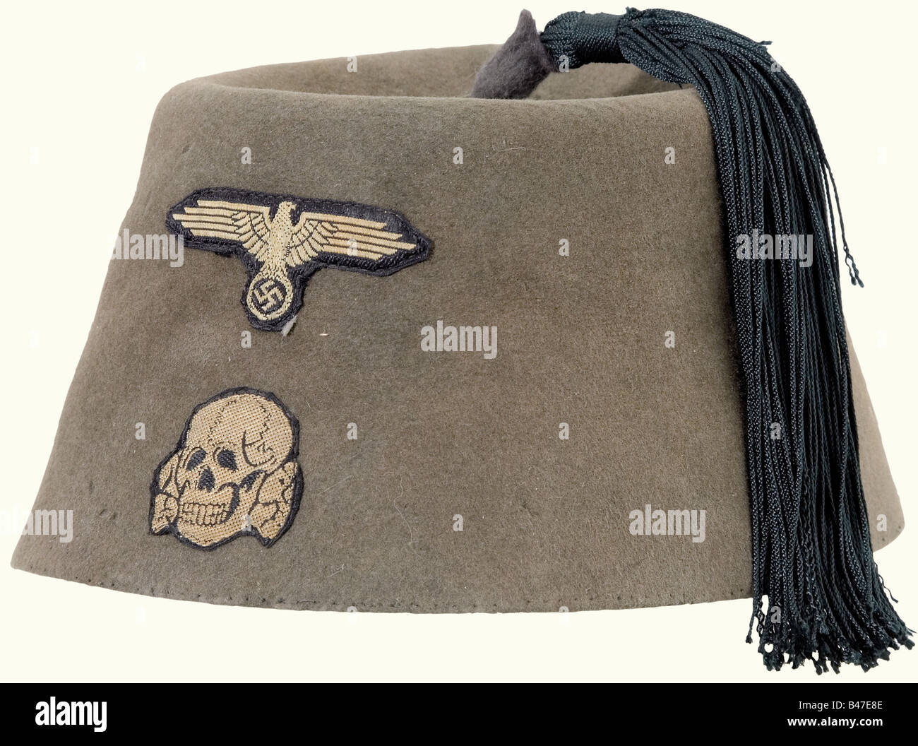 A fez for Enlisted Men/NCOs of the 'Handschar' Division., Field grey felt with a dark green tassel, machine sewn BeVo insignia. Moth damage. Sweatband torn out.' historic, historical, 1930s, 20th century, Waffen-SS, armed division of the SS, armed service, armed services, NS, National Socialism, Nazism, Third Reich, German Reich, Germany, military, militaria, utensil, piece of equipment, utensils, object, objects, stills, clipping, clippings, cut out, cut-out, cut-outs, fascism, fascistic, National Socialist, Nazi, Nazi period, uniform, uniforms, piece of cloth, Stock Photo