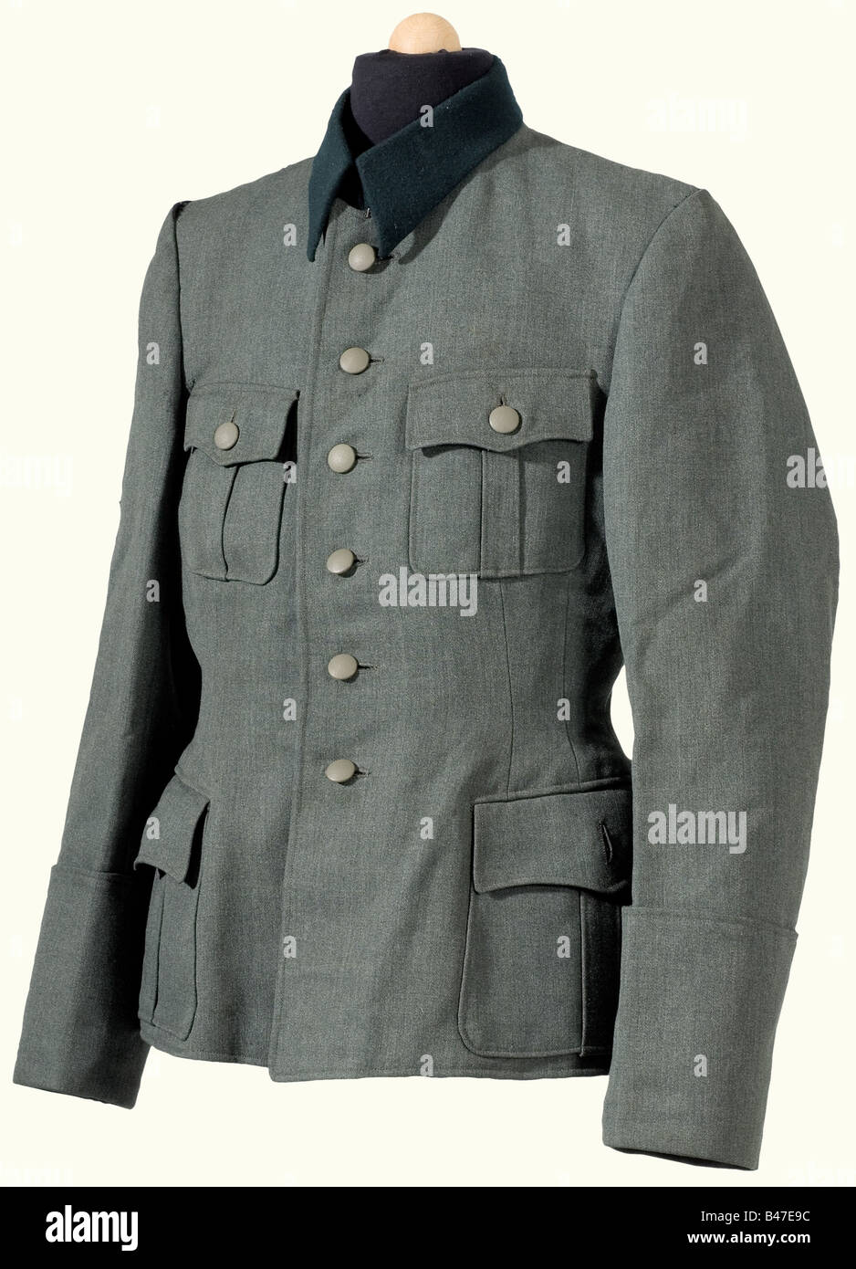 A tunic for an SS Officer., Field grey Italian gabardine, dark green collar, grey silk lining, field grey buttons, passage for a sidearm, marks where there was a sleeve band. historic, historical, 1930s, 1930s, 20th century, Waffen-SS, armed division of the SS, armed service, armed services, NS, National Socialism, Nazism, Third Reich, German Reich, Germany, military, militaria, utensil, piece of equipment, utensils, object, objects, stills, clipping, clippings, cut out, cut-out, cut-outs, fascism, fascistic, National Socialist, Nazi, Nazi period, uniform, unif, Stock Photo