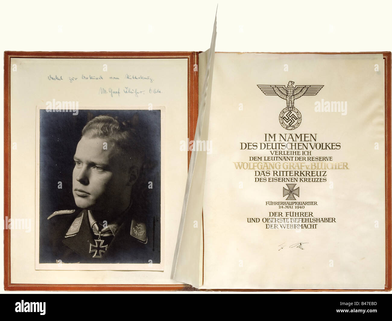 Oberleutnant (First Lieutenant) Wolfgang Count von Blücher - the citation, and folder for the award of the Knight's Cross of the Iron Cross 1939 on 24 May 1940. Large format, double parchment sheet with calligraphic citation text, hand written in dark brown ink and raised gold above Hitler's signature in ink. Respectable condition, the parchment has minimal staining and fold marks. In the red leather award folder decoratively stamped in gold. Interior lined with parchment, signed 'Frieda Thiersch' on lower right side. There is a hand written comment in ink, 'De, Stock Photo