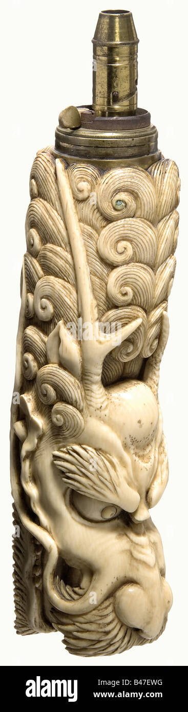 An ivory powder flask, Colonial English, 19th century. Lavishly carved ivory flask, older 18th century Chinese workmanship. The body is in the shape of a dragon with gaping jaws and eyes of inlaid mother-of-pearl. Brass patent spout, inscribed: 'Sykes'. Slightly dented. Length 23 cm. historic, historical, 19th century, powder flask, accessory, accessories, military, militaria, object, objects, stills, utilities, utility, clipping, clippings, cut out, cut-out, cut-outs, utensil, piece of equipment, utensils, vessel, vessels, Stock Photo
