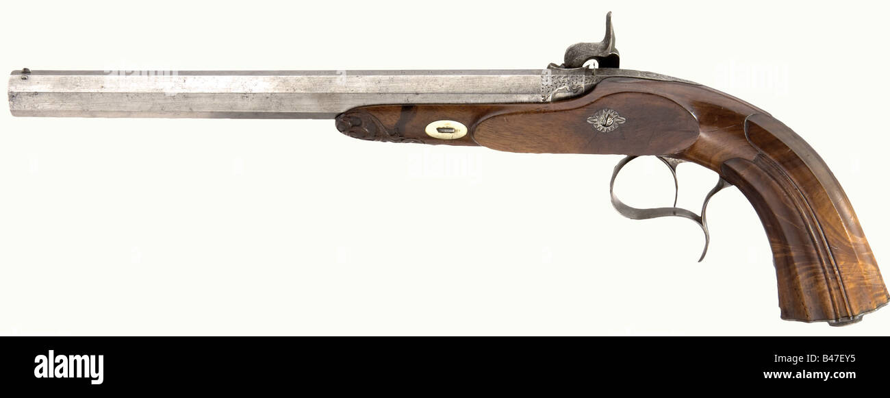 A cased pair of target pistols, Hermite à Saumur, circa 1840. Octagonal barrels with patent breeches, ten groove rifled bores in 12 mm calibre. Maker's signature engraved on top of the barrels. Locks are decorated with fine arabesque engraving. Beautifully figured, carved walnut half stocks. Engraved iron furniture. Length of each 43 cm. In a matching lockable case, lined with green velvet. Comprehensive and complete set of accessories with powder flask, nipple wrench, screwdriver, bullet mold, loading hammer, and cleaning rod. Dimensions 50 x 30 x 7 cm. histor, Stock Photo
