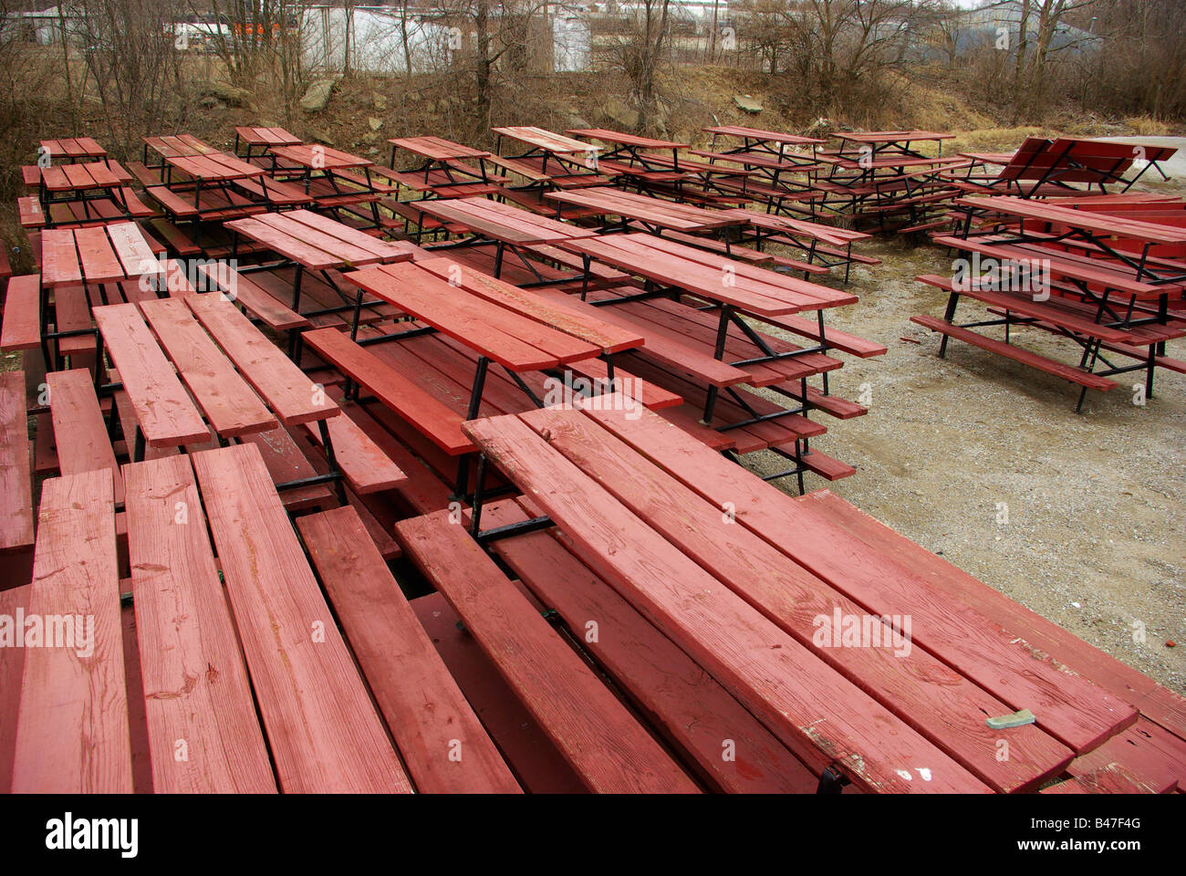 Many Park Benches Are Stacked And Left To The Elements In This