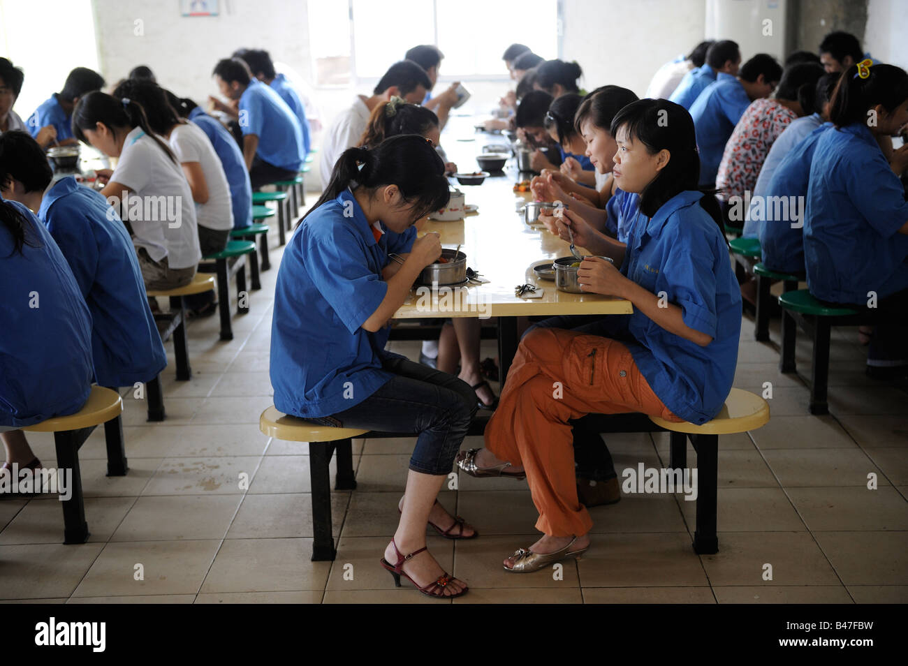 Workers have lunch at an industrial mold factory in Dongguan, Guangdong, China. 20-Sep-2008 Stock Photo