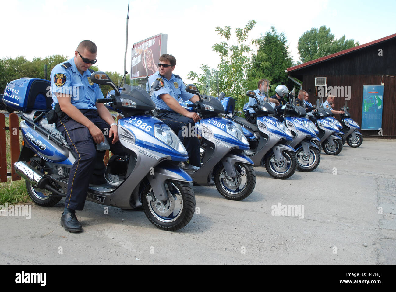 Polish municipal police officers on Romet RXL50 scooters Stock Photo - Alamy