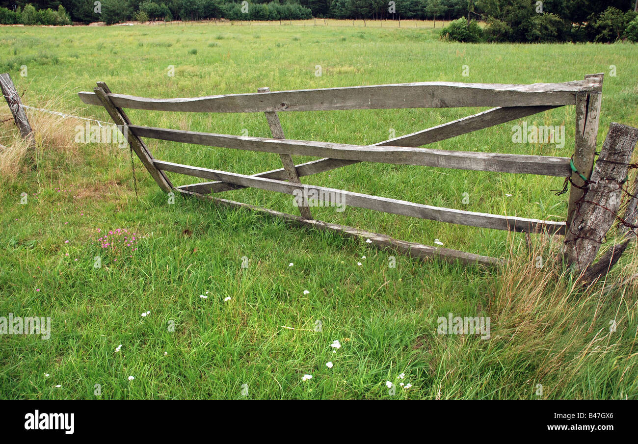 Barbed wire fence and wooden gate on polish countryside Stock Photo Alamy