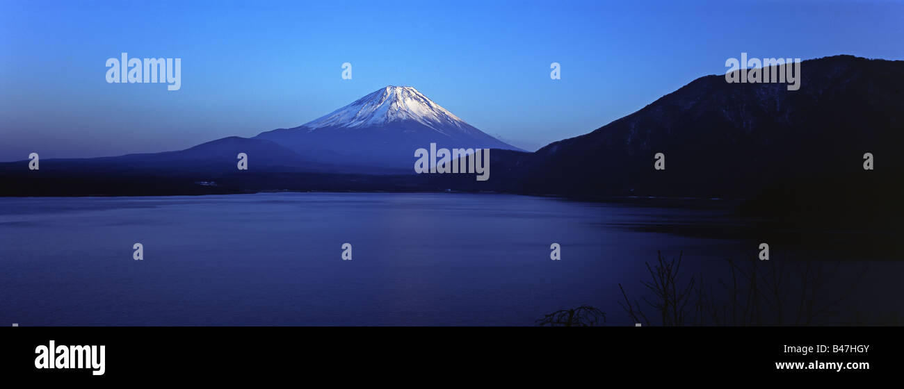 Japan, Mount Fuji, 3776m, viewed across Mototsu Ko, one of the lakes in the Fuji Go ko Fuji five lakes region Stock Photo