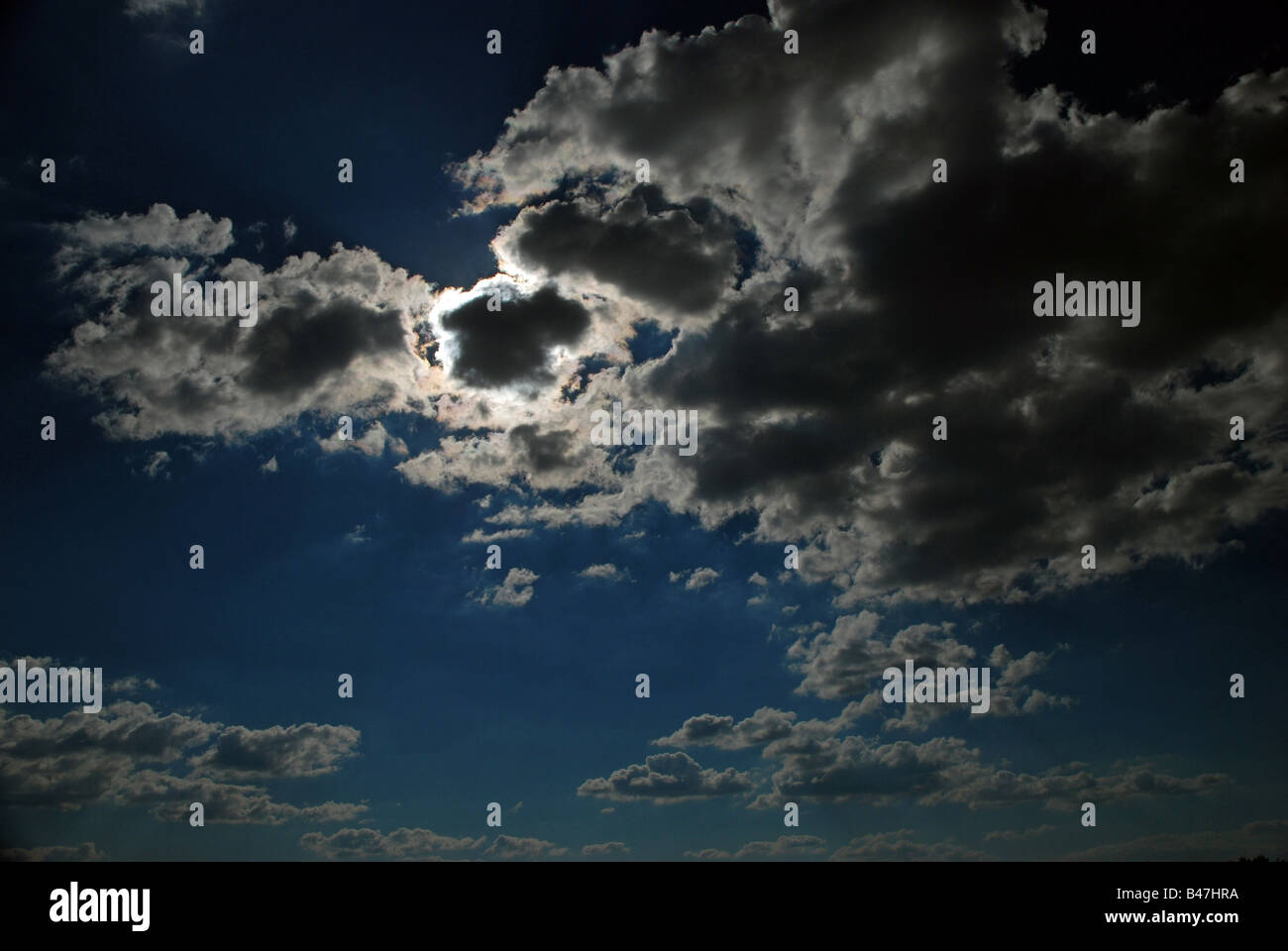 Sun shining through the clouds Stock Photo - Alamy