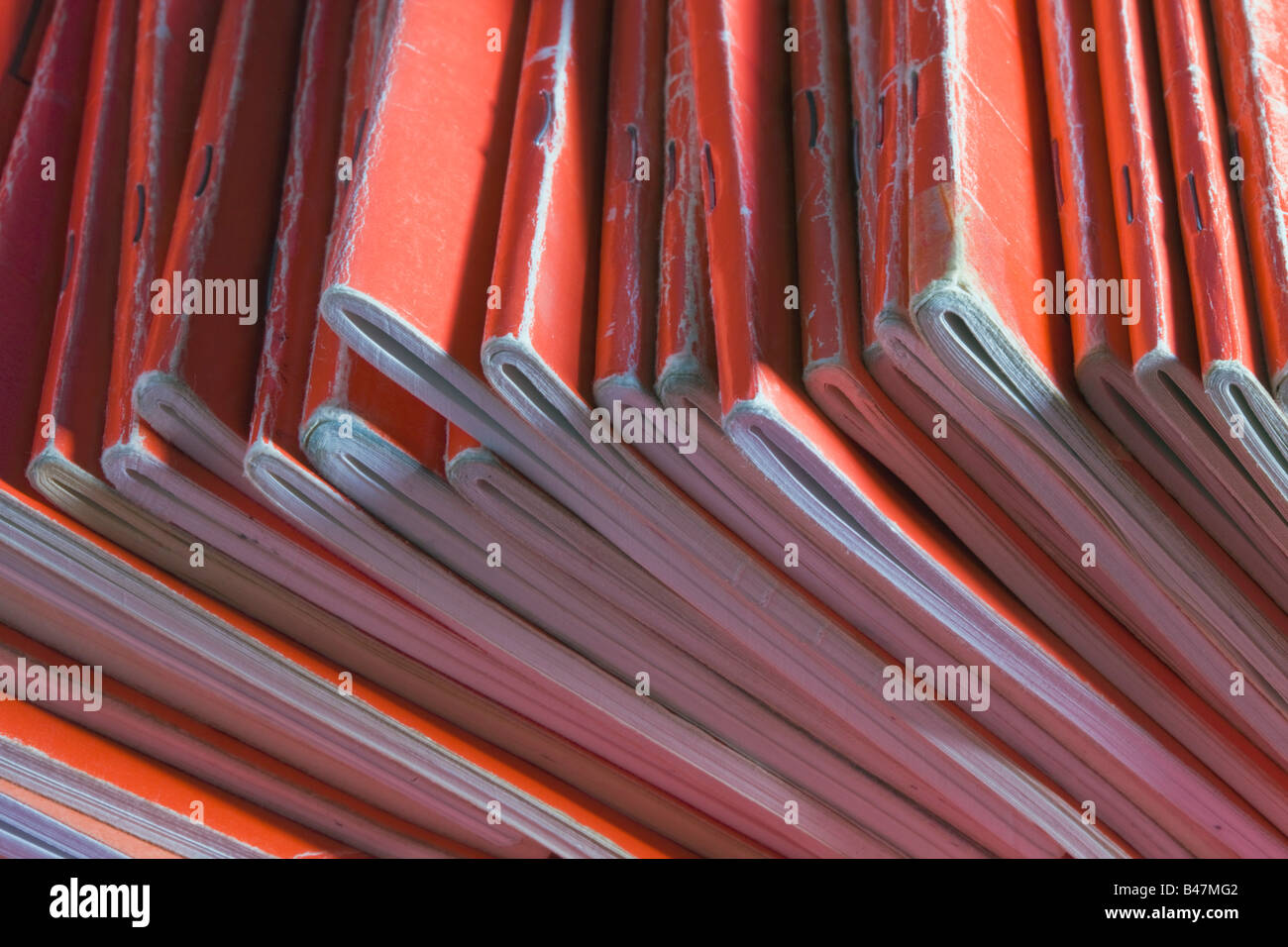 Collection of well used red notebooks Stock Photo