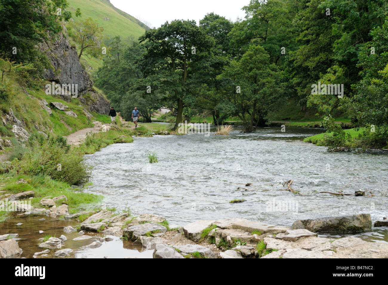 Walkers by the River Dove Dovedale The peak District UK September Stock Photo