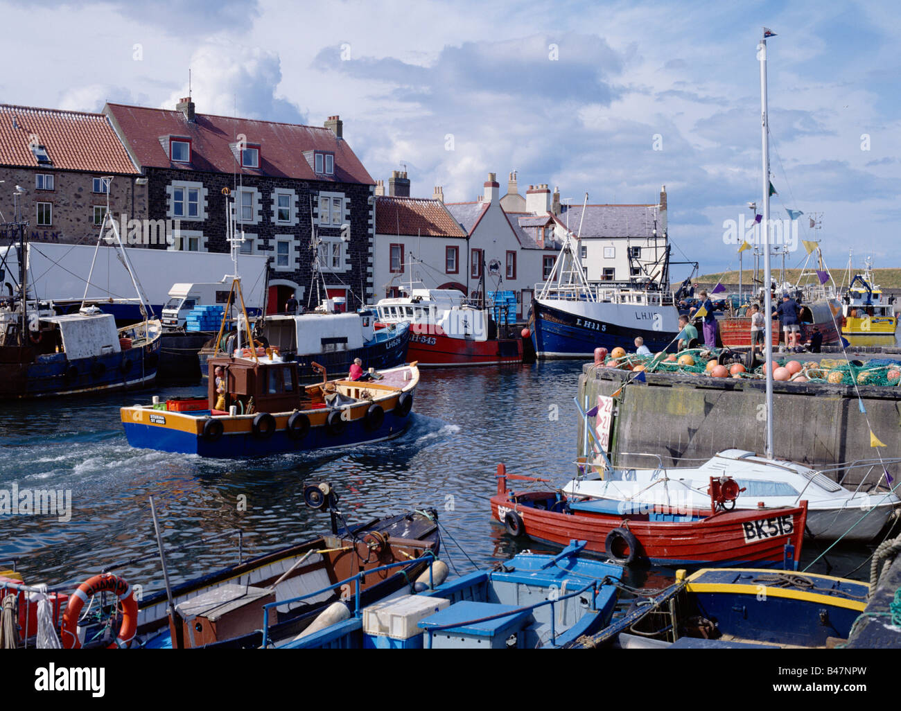 dh Berwickshire coast EYEMOUTH HARBOUR BORDERS SCOTLAND Scottish fishing boat Departing yachts boats at quayside coastal waterfront Stock Photo