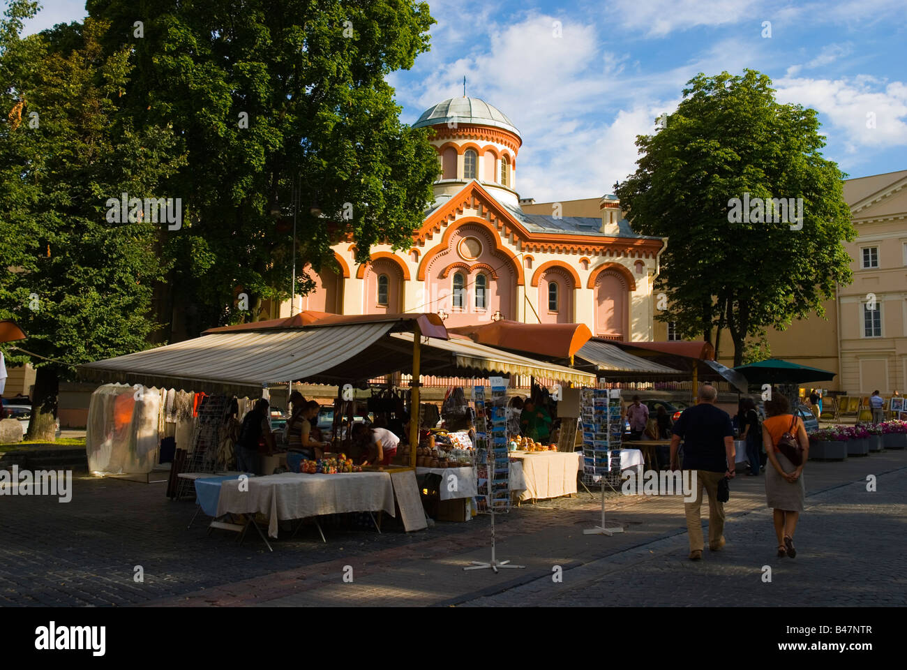 Market stalls along Pilies gatve street with St Parasceve s Orthodox church in background in Vilnius Lithuania Europe Stock Photo