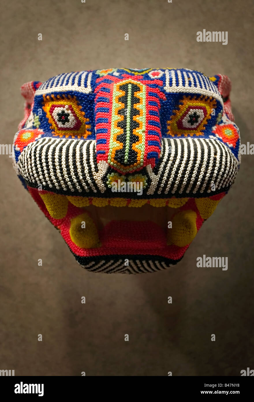 Beaded jaguar mask made by the Huichol indians of central Mexico at the National Museum of Anthropology in Mexico City. Stock Photo