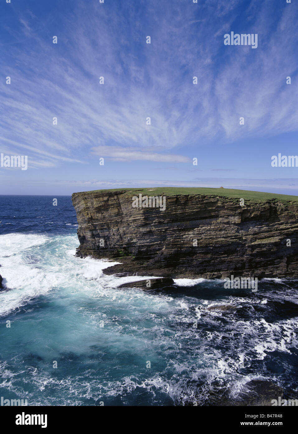 dh Brough of Bigging YESNABY ORKNEY Sea waves rough seas blue sky cliffs coast cirrus cloud windy weather cliff scotland coastline Stock Photo