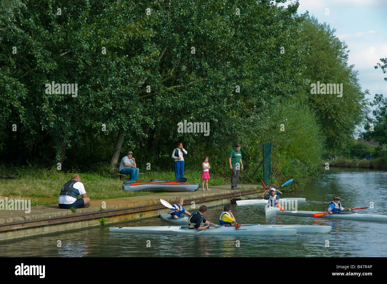 Young children learning to canoe on the grand Union canal in West