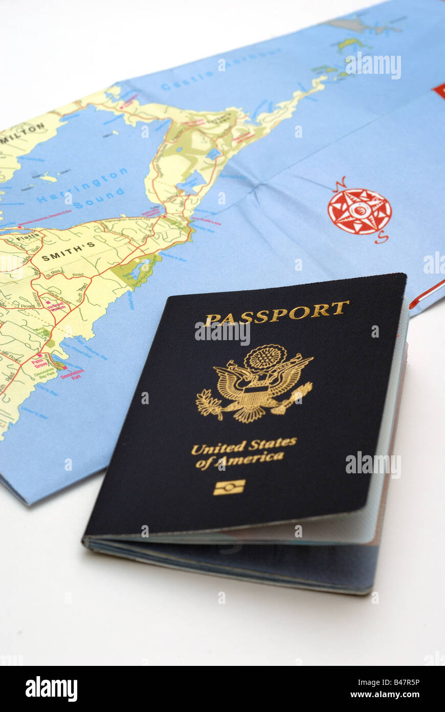 A United States Passport and a - A United States Passport And A Folded Map Of Bermuda Illustrate The B47R5P 