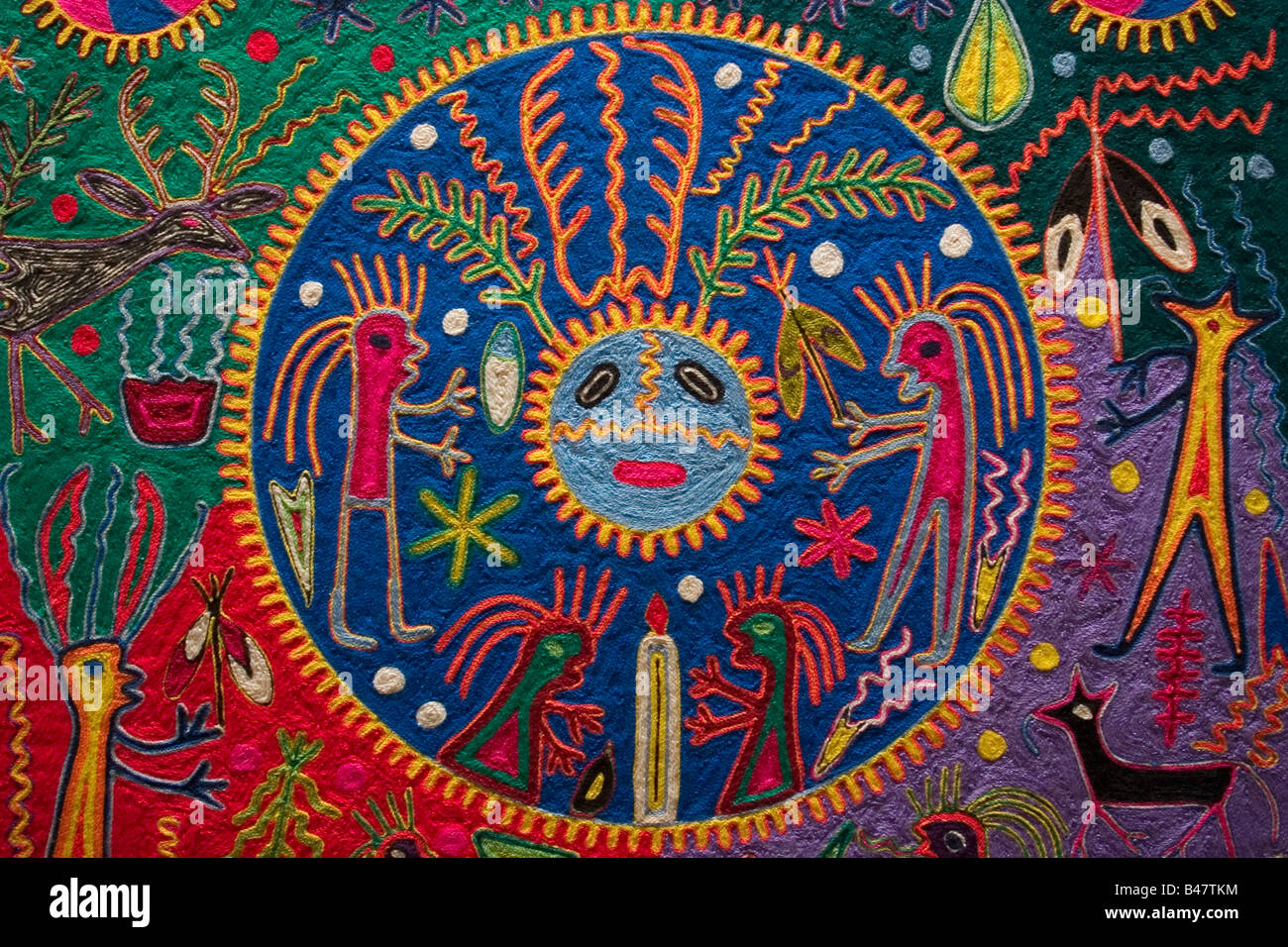Neirika yarn painting made by the Huichol indians of central Mexico at the National Museum of Anthropology in Mexico City. Stock Photo