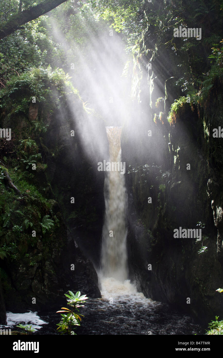 Shafts of sunlight in the spray from waterfall Stock Photo Alamy