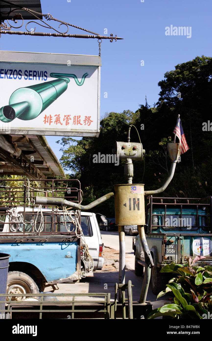 Creative Signboard In Human Form Made From Car Exhaust Parts Stock Photo Alamy