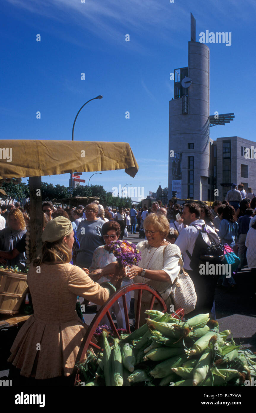 Woman buying flowers at a 19thcentury French market, Old Port of