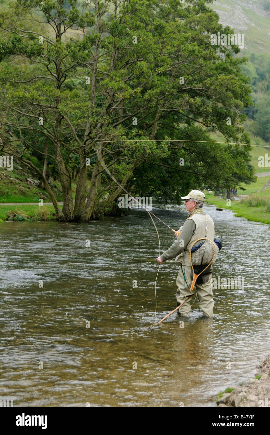 Fly fishing for Brown Trout and Grayling on the River Dove Peak District UK September Stock Photo