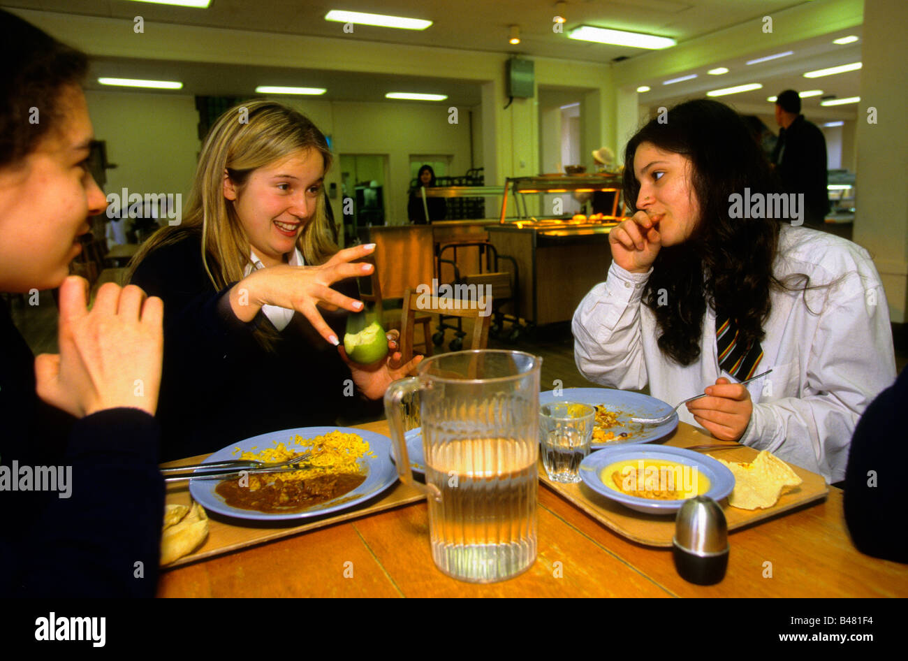 Girls at Benenden girls public school, one of the UK's most expensive private schools talk while eating lunch, Kent Stock Photo
