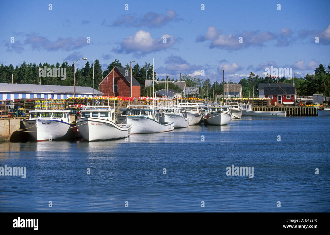 Fishing boats await the tide in a tiny colorful fishing village of