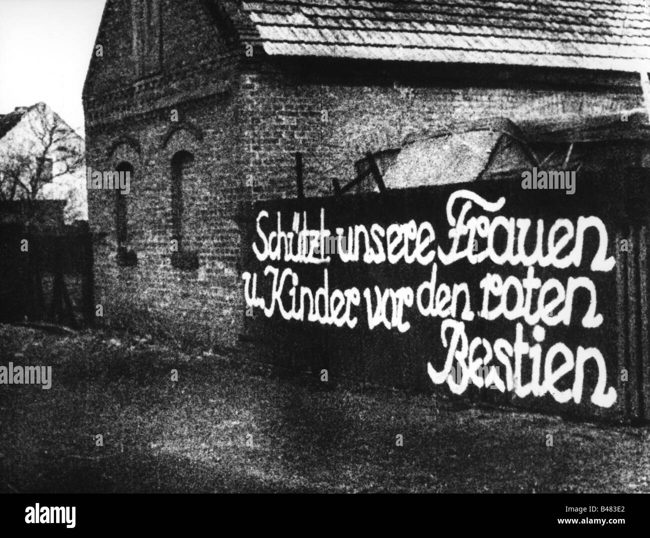 events, Second World War / WWII, Germany, slogan 'Protect our women and children against the red beasts', Berlin, 1945, Stock Photo