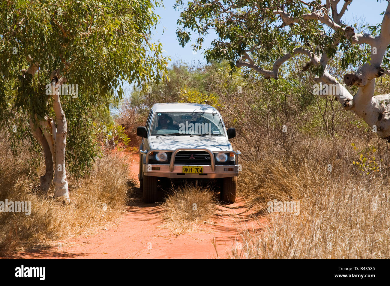 A four wheel drive vehicle on an outback road near Broome in the Kimberley country of Australia Stock Photo