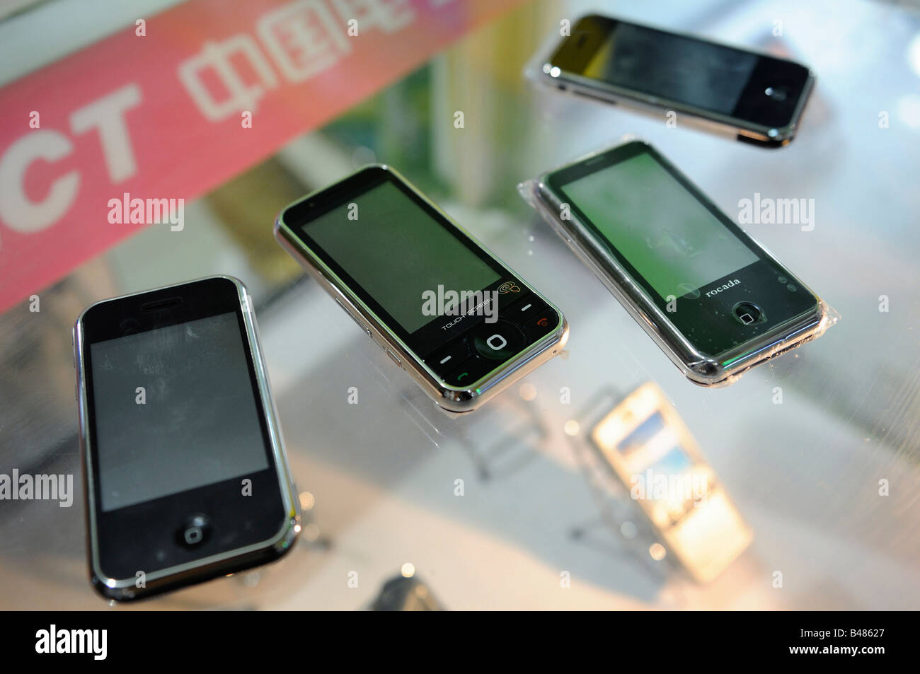 Imitation cell phones like the Apple's iPhone are on sale in a cell phones market in Beijing, China. 26-Sep-2008 Stock Photo