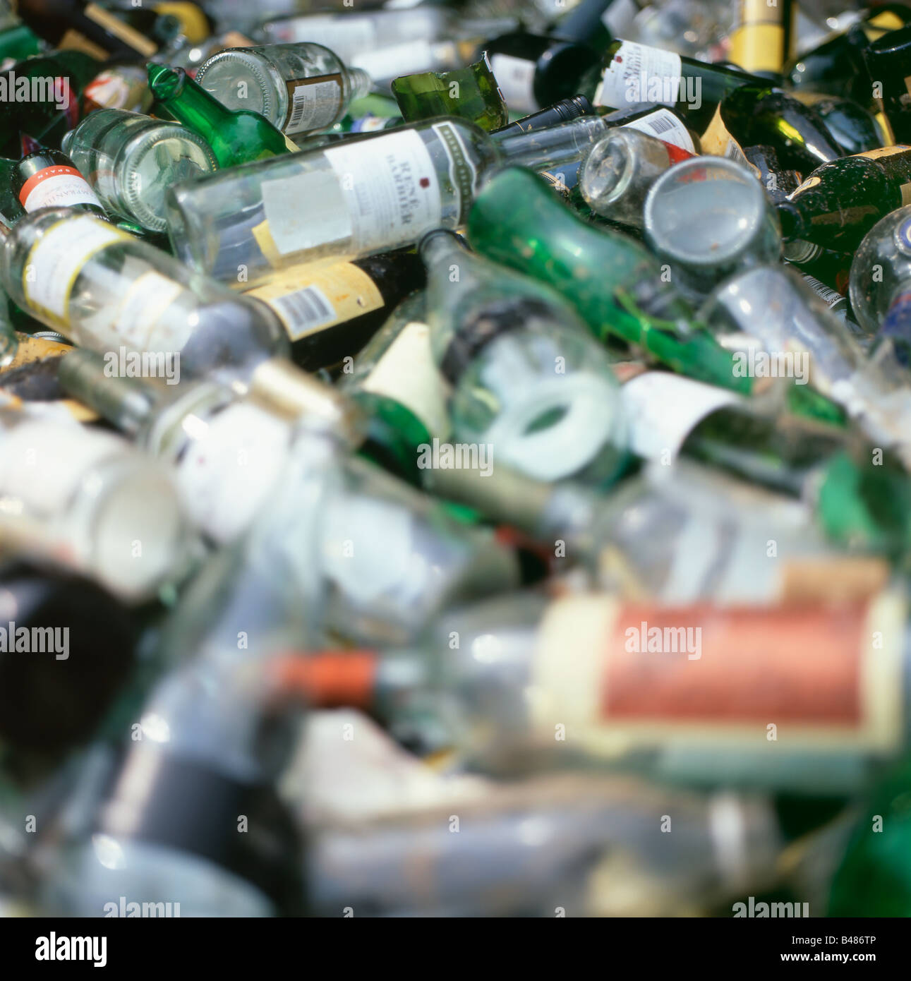 Empty wine bottles in a bottle bank recycling centre Wales UK KATHY