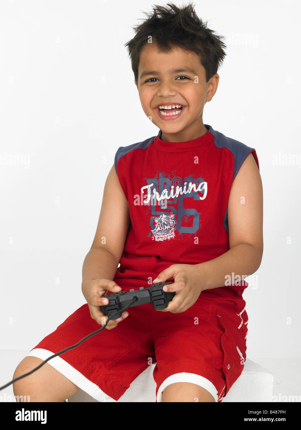 asain boy playing on his play station Stock Photo