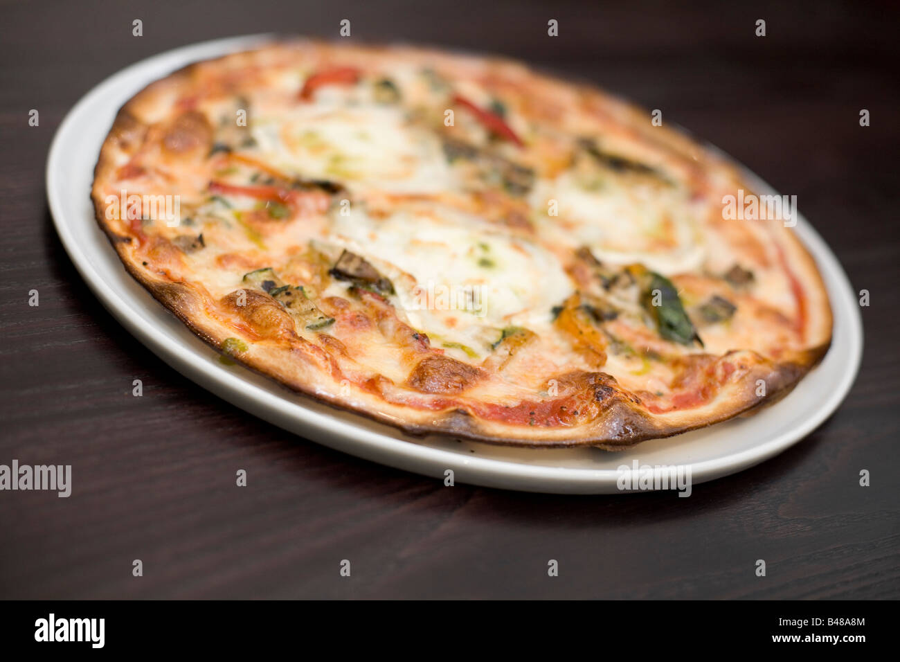 Goats cheese and roasted vegetable pizza Stock Photo Alamy