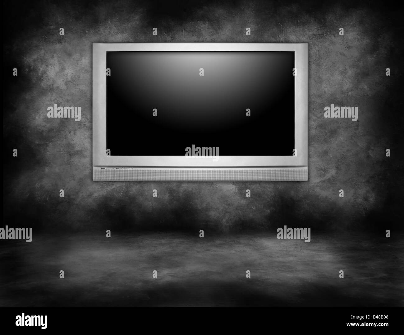 Silver Plasma Television Hanging on an Interior Wall in a Darkened Room Stock Photo