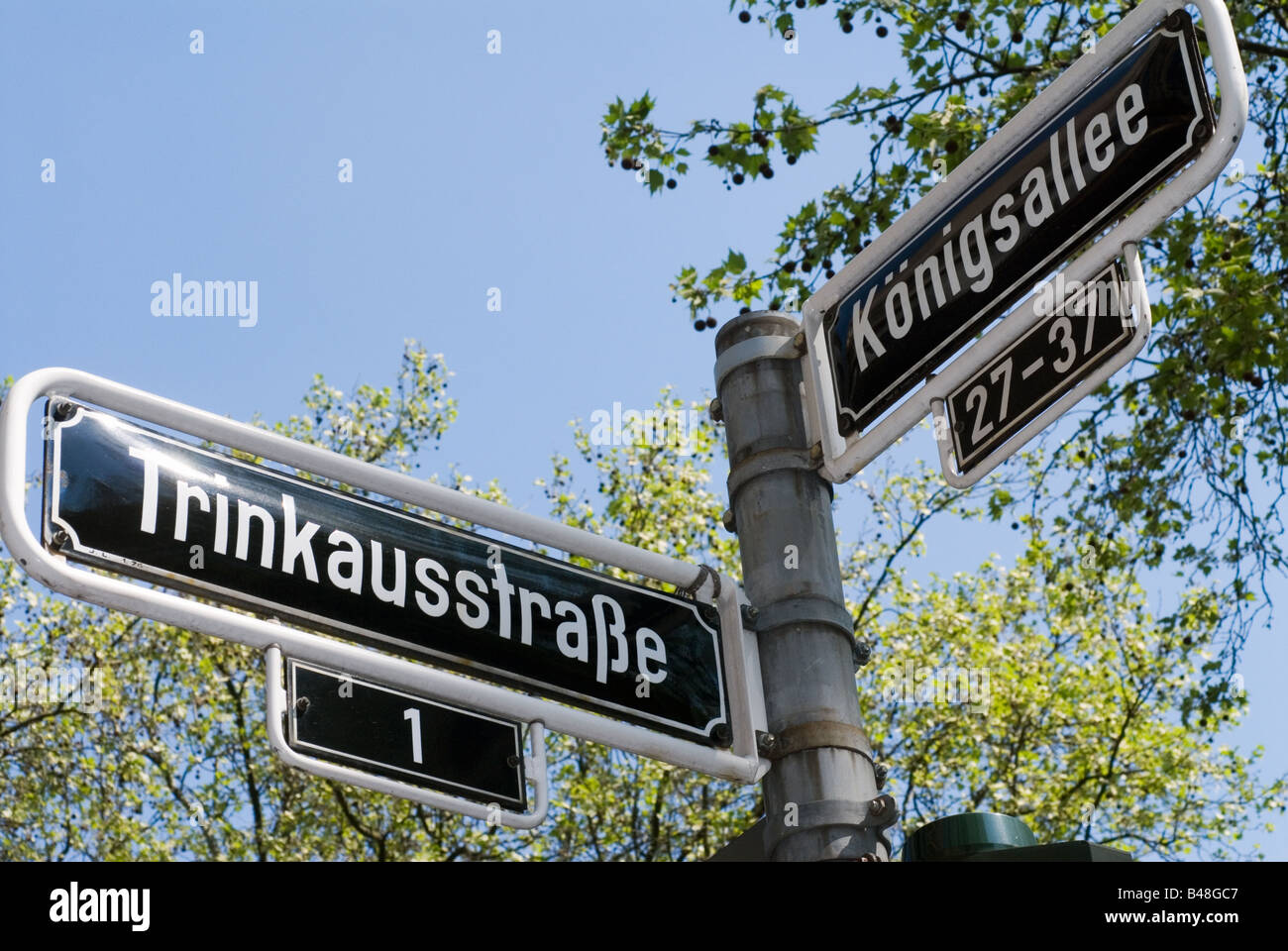 Street signs of the corner Trinkausstrasse Koenigsallee in Duesseldorf Germany Stock Photo