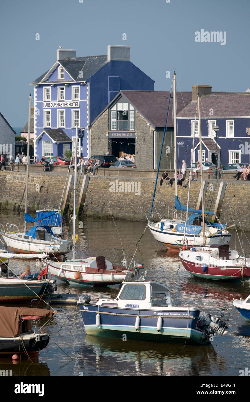 Aberaeron Ceredigion Wales UK, with the Harbourmaster hotel on the quayside, summer afternoon, yachts in the harbour Stock Photo