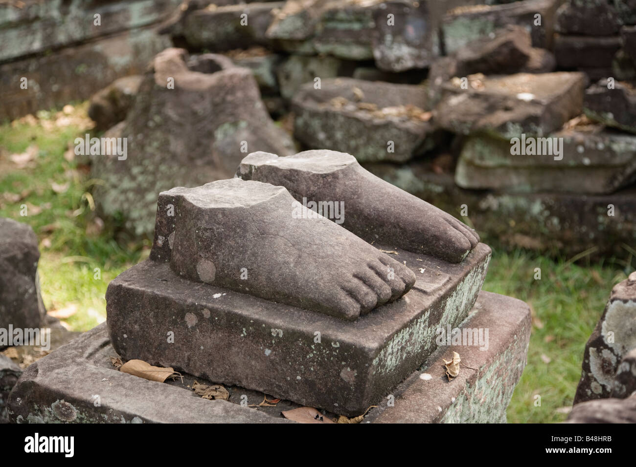 Stone feet of a broken statue at Preah Khan, Angkor, Cambodia Stock