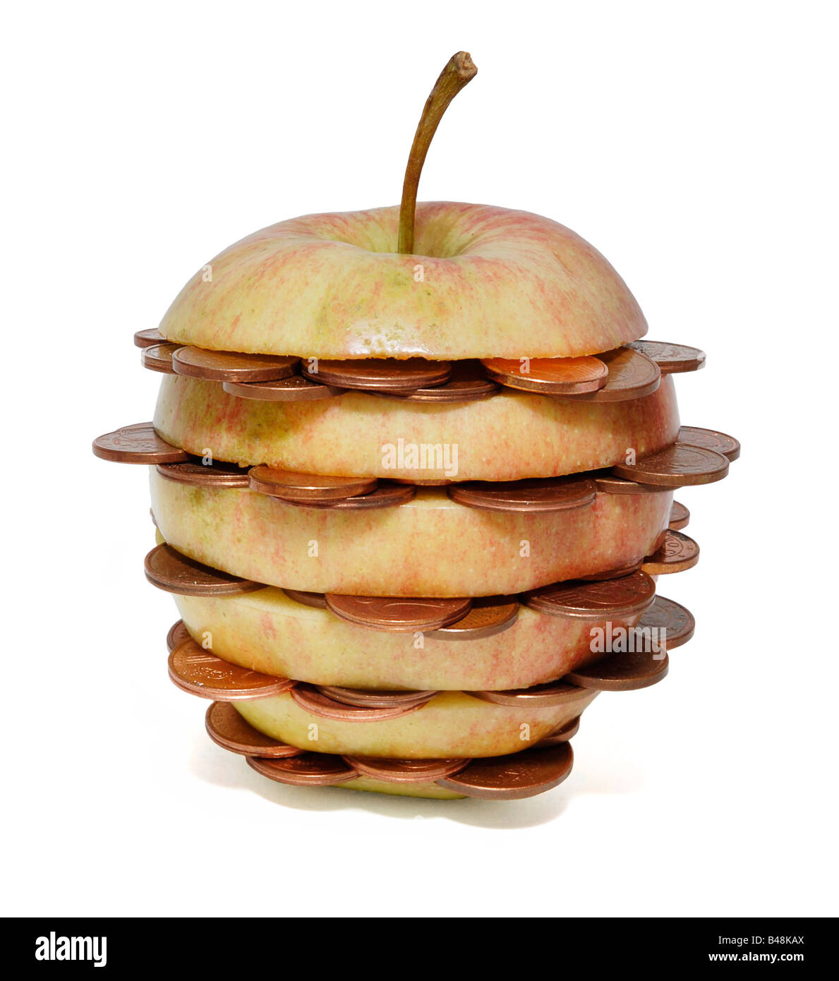 An apple with coins inside Stock Photo