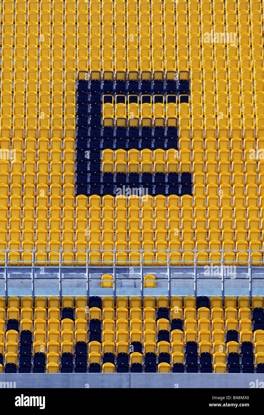 Big “E” formed by seats in a stadion Stock Photo