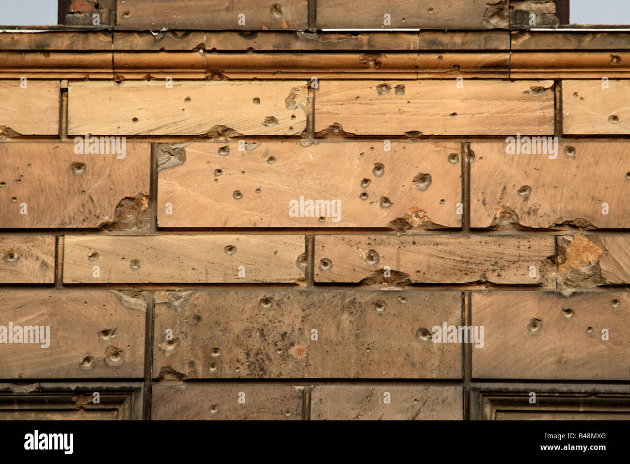 Bullet holes from World War II on a wall in the centre of Berlin Stock Photo