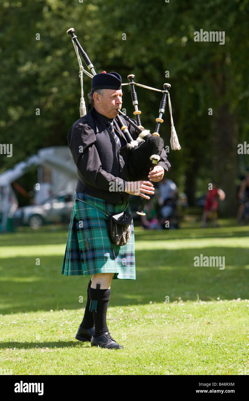 A lone piper plays the bagpipes Stock Photo - Alamy
