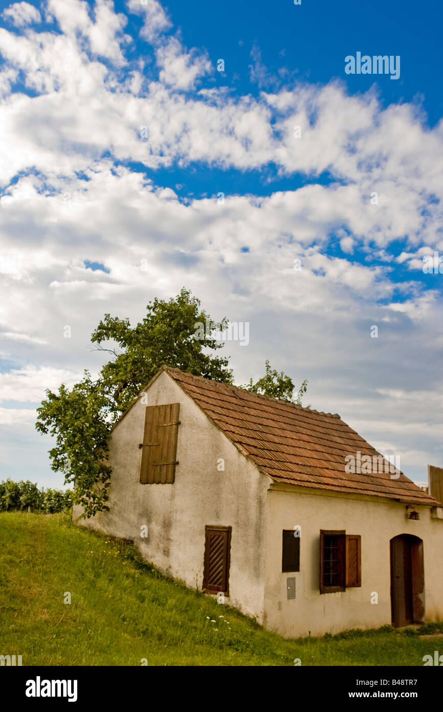 Old rural house against a blue sky with an interesting cloudscape Stock ...